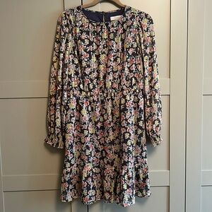 Sheer fabric and gold pattern with cute ruffle detail mini dress.